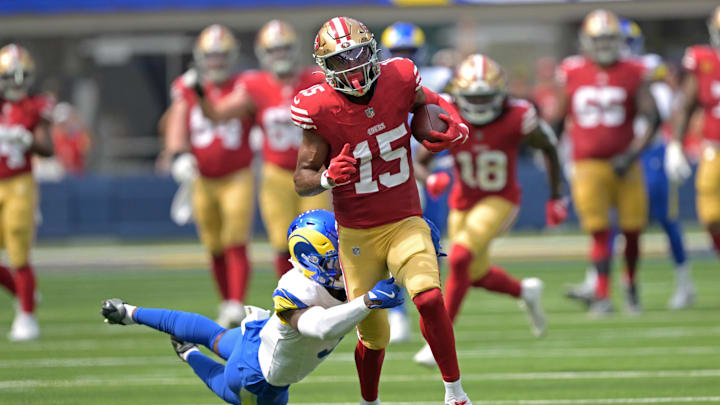 Sep 22, 2024; Inglewood, California, USA;  San Francisco 49ers wide receiver Jauan Jennings (15) is stopped by Los Angeles Rams safety Kamren Curl (3) after a first down in the first half at SoFi Stadium. Mandatory Credit: Jayne Kamin-Oncea-Imagn Images