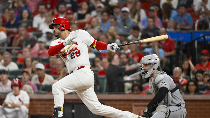 May 19, 2025; St. Louis, Missouri, USA;  St. Louis Cardinals third baseman Nolan Arenado (28) drives in a run against the Detroit Tigers during the fifth inning at Busch Stadium. Mandatory Credit: Jeff Curry-Imagn Images