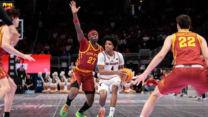 Mar 12, 2026; Kansas City, MO, USA; Texas Tech Red Raiders guard Christian Anderson (4) brings the ball up court around Iowa State Cyclones guard Killyan Toure (27) during the first half at T-Mobile Center. 