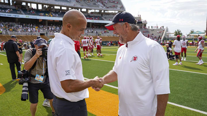 Baylor Bears head coach Dave Aranda and Utah Utes head coach Kyle Whittingham shake hands prior to a game at McLane Stadium. Baylor Bears head coach Dave Aranda and Utah Utes head coach Kyle Whittingham shake hands prior to a game at McLane Stadium.