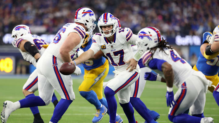 Dec 23, 2023; Inglewood, California, USA;  Buffalo Bills quarterback Josh Allen (17) hands the ball off to fullback Reggie Gilliam (41).