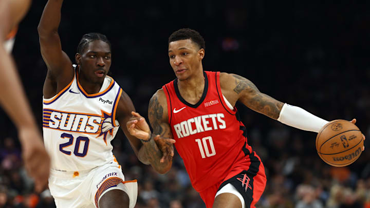 Nov 24, 2025; Phoenix, Arizona, USA; Phoenix Suns forward Rasheer Fleming (20) defends against Houston Rockets forward Jabari Smith Jr. (10) in the first half at Mortgage Matchup Center. Mandatory Credit: Mark J. Rebilas-Imagn Images
