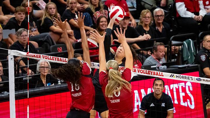 Oct 10, 2026; Lincoln, Nebraska, USA;  Nebraska Cornhuskers opposite Virginia Adriano (3) attacks against Wisconsin Badgers outside hitter Decelise Champion (16) and middle blocker Lynney Tarnow (20) during the second set at Bob Devaney Sport Center.  Mandatory Credit: Dylan Widger-Imagn Images