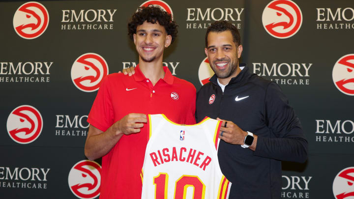 Jun 28, 2024; Atlanta, Georgia, USA; Atlanta Hawks first overall draft pick Zaccharie Risacher poses for a photo with general manager Landry Fields at the Emory Sports Medicine Complex. Mandatory Credit: Brett Davis-USA TODAY Sports