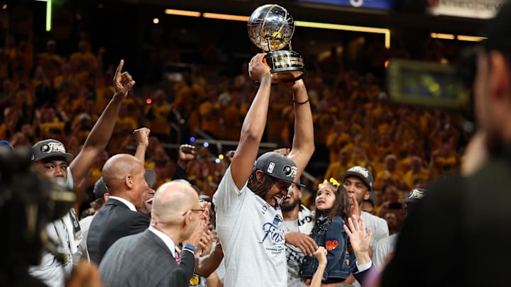 May 31, 2025; Indianapolis, Indiana, USA; Indiana Pacers center Myles Turner (33) raises the trophy after game six of the eastern conference finals against the New York Knicks for the 2025 NBA Playoffs at Gainbridge Fieldhouse. Mandatory Credit: Trevor Ruszkowski-Imagn Images