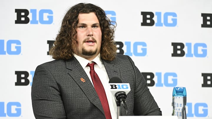 Jul 24, 2024; Indianapolis, IN, USA; USC Trojans offensive lineman Jonah Monheim speaks to the media during the Big 10 football media day at Lucas Oil Stadium. Mandatory Credit: Robert Goddin-Imagn Images Jul 24, 2024; Indianapolis, IN, USA; USC Trojans offensive lineman Jonah Monheim speaks to the media during the Big 10 football media day at Lucas Oil Stadium. Mandatory Credit: Robert Goddin-Imagn Images