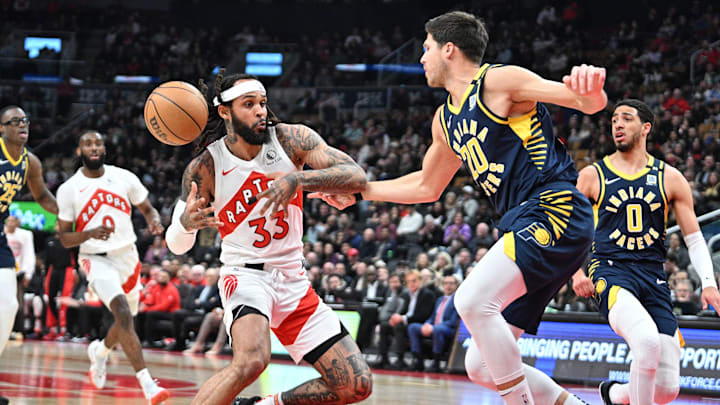 Apr 9, 2024; Toronto, Ontario, CAN;  Indiana Pacers forward Doug McDermott (20) knocks the ball from the hands of Toronto Raptors guard Gary Trent Jr. (3) in the first half at Scotiabank Arena. Mandatory Credit: Dan Hamilton-USA TODAY Sports