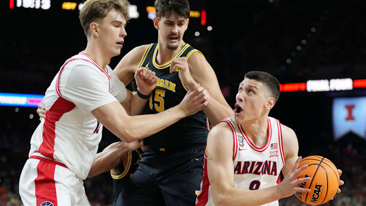 Apr 4, 2026; Indianapolis, IN, USA; Arizona Wildcats forward Ivan Kharchenkov (8) controls the ball against the Michigan Wolverines during a semifinal of the Final Four of the men's 2026 NCAA Tournament at Lucas Oil Stadium. Mandatory Credit: Bob Donnan-Imagn Images