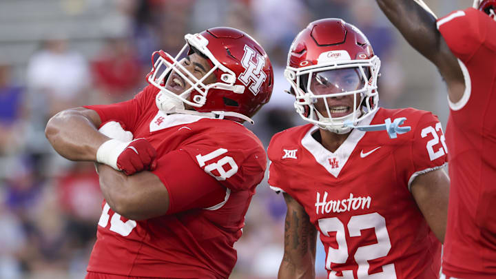Houston Cougars defensive lineman Khalil Laufau (18) celebrates with defensive back Marc Stampley II (22) after a defenisve play during the first quarter against the Stephen F. Austin Lumberjacks at TDECU Stadium.