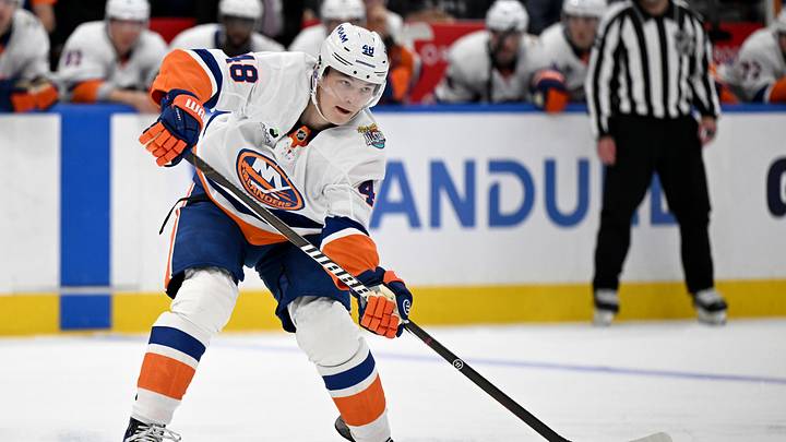 Sep 30, 2026; Toronto, Ontario, CAN;  New York Islanders defenseman Matthew Schaefer (48) passes the puck against the Toronto Maple Leafs in the second period at Scotiabank Arena.  Mandatory Credit: Dan Hamilton-Imagn Images