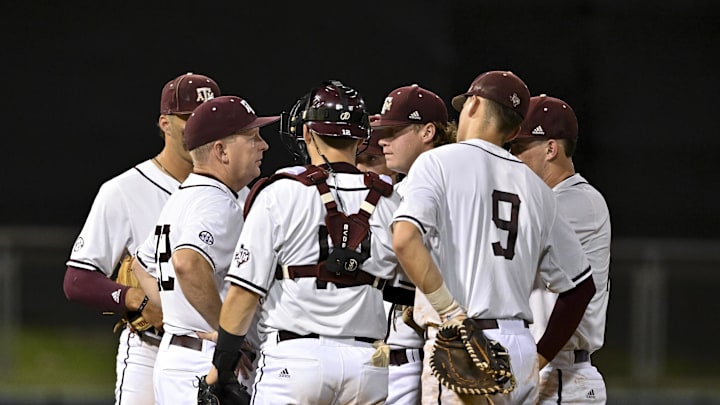 Jun 10, 2022; College Station, TX, USA; Texas A&M head coach Jim Schlossnagle walk out for a mound visit during the top of the sixth inning during the super regional game one against the Texas A&M Mandatory Credit: Maria Lysaker-Imagn Images