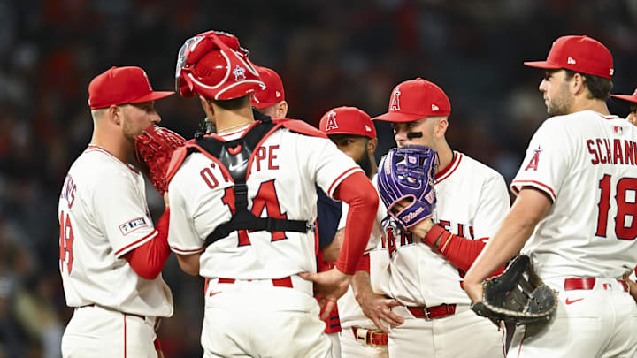 Apr 19, 2025; Anaheim, California, USA; Los Angeles Angels pitcher Reid Detmers (48), shortstop Zach Neto (9), catcher Logan O'Hoppe (14), first baseman Nolan Schanuel (18), and other teammates meet at the mound against the San Francisco Giants during the sixth inning at Angel Stadium. Mandatory Credit: Jonathan Hui-Imagn Images