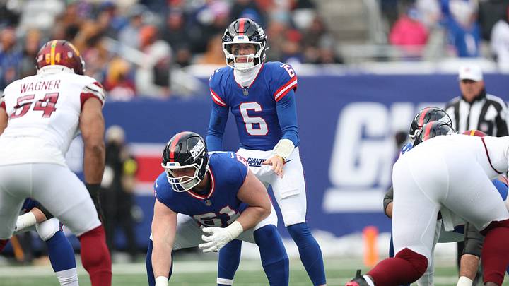 New York Giants quarterback Jaxson Dart (6) awaits the snap from center John Michael Schmitz Jr. New York Giants quarterback Jaxson Dart (6) awaits the snap from center John Michael Schmitz Jr.