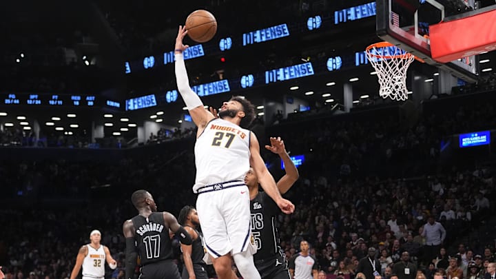 Denver Nuggets point guard Jamal Murray (27) shoots a reverse layup against the Brooklyn Nets during the first half at Barclays Center. Mandatory Credit: Gregory Fisher-Imagn Images