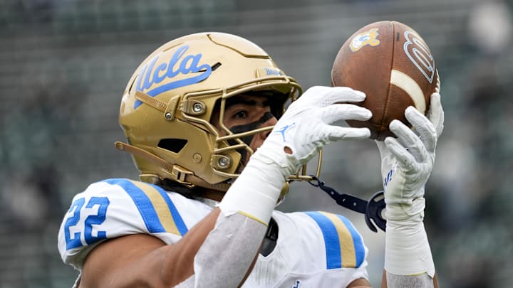 Oct 11, 2025; East Lansing, Michigan, USA; UCLA  Bruins unning back Anthony Frias II (22) catches a pass during warmups before a game at Spartan Stadium. Mandatory Credit: Brendan Mullin-Imagn Images