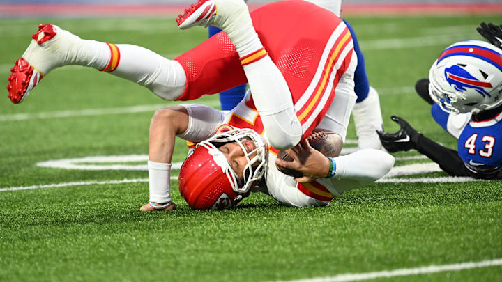 Nov 17, 2024; Orchard Park, New York, USA; Kansas City Chiefs quarterback Patrick Mahomes (15) is sacked by Buffalo Bills linebacker Terrel Bernard (43) in the first quarter at Highmark Stadium. Mandatory Credit: Mark Konezny-Imagn Images