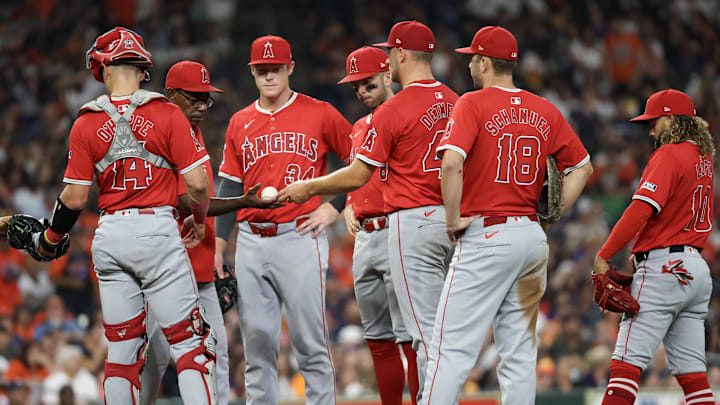 Sep 21, 2024; Houston, Texas, USA;  Los Angeles Angels manager Ron Washington takes out starting pitcher Reid Detmers (48) in the third inning against the Houston Astros at Minute Maid Park. Mandatory Credit: Thomas Shea-Imagn Images