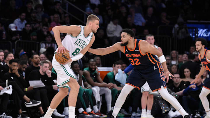 Apr 8, 2025; New York, New York, USA; Boston Celtics center Kristaps Porzingis (8) looks for an opening against New York Knicks center Karl-Anthony Towns (32) during the first half at Madison Square Garden. Mandatory Credit: John Jones-Imagn Images Apr 8, 2025; New York, New York, USA; Boston Celtics center Kristaps Porzingis (8) looks for an opening against New York Knicks center Karl-Anthony Towns (32) during the first half at Madison Square Garden. Mandatory Credit: John Jones-Imagn Images