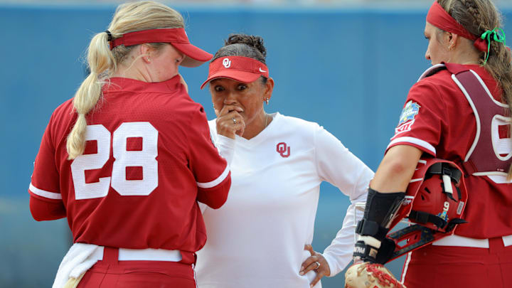 Oklahoma pitching coach Jennifer Rocha talks with pitcher Kelly Maxwell (28) beside catcher Kinzie Hansen (9) a Women's College World Series softball game between the University of Oklahoma Sooners (OU) and the UCLA Bruins at Devon Park in Oklahoma City, Saturday, June 1, 2024. Rocha returned to the Sooners last weekend after battling cancer. Oklahoma pitching coach Jennifer Rocha talks with pitcher Kelly Maxwell (28) beside catcher Kinzie Hansen (9) a Women's College World Series softball game between the University of Oklahoma Sooners (OU) and the UCLA Bruins at Devon Park in Oklahoma City, Saturday, June 1, 2024. Rocha returned to the Sooners last weekend after battling cancer.