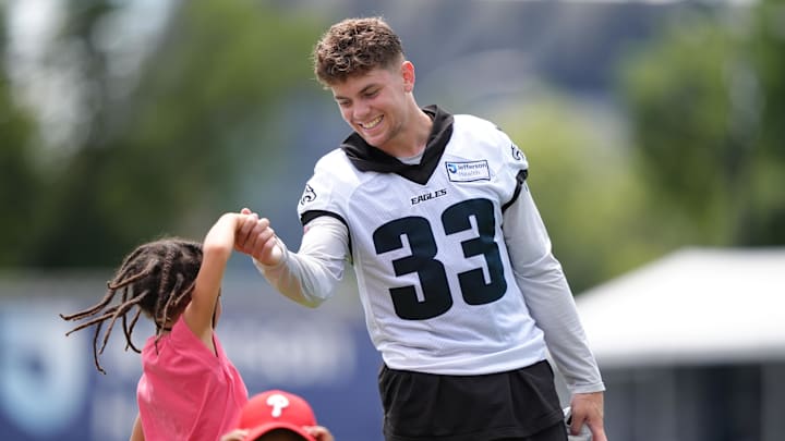 Philadelphia, PA, USA; Philadelphia Eagles defensive back Cooper DeJean (33) plays with the children of running back Saquon Barkley during training camp at NovaCare Complex. Philadelphia, PA, USA; Philadelphia Eagles defensive back Cooper DeJean (33) plays with the children of running back Saquon Barkley during training camp at NovaCare Complex.