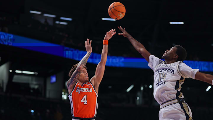 Jan 6, 2026; Atlanta, Georgia, USA; Syracuse Orange guard Nate Kingz (4) shoots over Georgia Tech Yellow Jackets forward Kowacie Reeves Jr. (14) in the first half at McCamish Pavilion. Mandatory Credit: Brett Davis-Imagn Images
