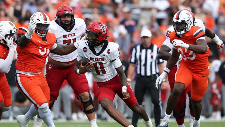 Aug 29, 2026; Charlottesville, Virginia, USA; North Carolina State Wolfpack quarterback CJ Bailey (11) carries the ball during the second quarter against the Virginia Cavaliers at Scott Stadium. Mandatory Credit: Greg Atkins-Imagn Images Aug 29, 2026; Charlottesville, Virginia, USA; North Carolina State Wolfpack quarterback CJ Bailey (11) carries the ball during the second quarter against the Virginia Cavaliers at Scott Stadium. Mandatory Credit: Greg Atkins-Imagn Images