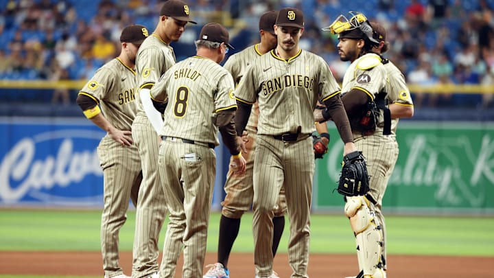Sep 1, 2024; St. Petersburg, Florida, USA;  San Diego Padres pitcher Dylan Cease (84) is taken out  of the game by manager Mike Shildt (8) against the Tampa Bay Rays during the sixth inning at Tropicana Field. Mandatory Credit: Kim Klement Neitzel-Imagn Images