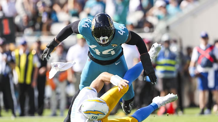 Nov 16, 2025; Jacksonville, Florida, USA; Jacksonville Jaguars defensive end Travon Walker (44) reacts after pressuring Los Angeles Chargers quarterback Justin Herbert (10) into an intentional grounding penalty during the first quarter at EverBank Stadium.
