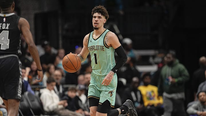 Feb 7, 2025; Charlotte, North Carolina, USA;Charlotte Hornets guard LaMelo Ball (1) brings the ball up court against the San Antonio Spurs  during the first quarter at Spectrum Center. Mandatory Credit: Jim Dedmon-Imagn Images