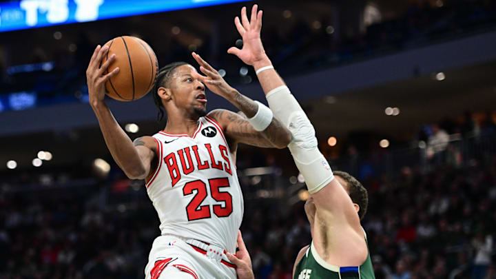 Nov 20, 2024; Milwaukee, Wisconsin, USA; Chicago Bulls guard Dalen Terry (25) shoots against Milwaukee Bucks center Brook Lopez (11) in the second quarter at Fiserv Forum. Mandatory Credit: Benny Sieu-Imagn Images