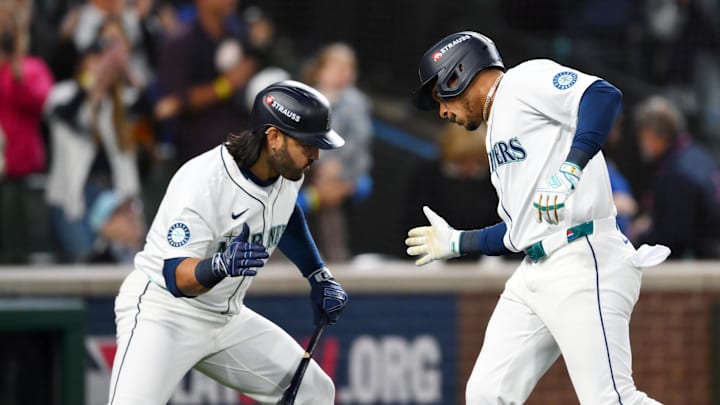 Oct 5, 2025; Seattle, Washington, USA; Seattle Mariners second baseman Jorge Polanco (7) celebrates his solo home run with third baseman Eugenio Suarez (28) in the sixth inning against the Detroit Tigers during game two of the ALDS round for the 2025 MLB playoffs at T-Mobile Park. Mandatory Credit: Steven Bisig-Imagn Images