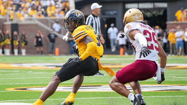 Sep 14, 2024; Columbia, Missouri, USA; Missouri Tigers wide receiver Luther Burden III (3) catches a pass as Boston College Eagles defensive back Cameron Martinez (29) defends during the first half at Faurot Field at Memorial Stadium. Mandatory Credit: Denny Medley-Imagn Images