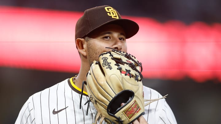 Aug 2, 2025; San Diego, California, USA; San Diego Padres third baseman Manny Machado (13) walks off the field during the third inning against the St. Louis Cardinals at Petco Park. Mandatory Credit: David Frerker-Imagn Images