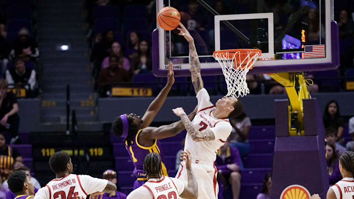 Feb 10, 2026; New Orleans, Louisiana, USA; LSU Tigers forward Mike Nwoko (1) has his shot blocked by Arkansas Razorbacks forward Trevon Brazile (7) during the first half at Smoothie King Center. Mandatory Credit: Matthew Hinton-Imagn Images