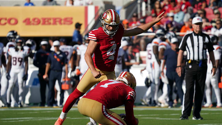 Aug 9, 2025; Santa Clara, California, USA;  San Francisco 49ers kicker Jake Moody (4) kicks an extra point as punter Thomas Morstead (7) holds the ball in the first quarter against the Denver Broncos at Levi's Stadium. Mandatory Credit: David Gonzales-Imagn Images