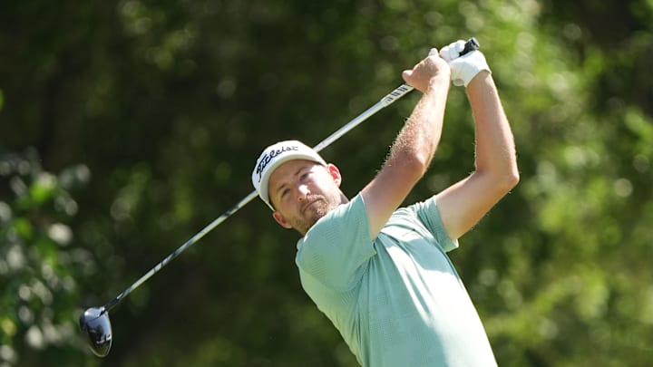 May 23, 2025; Fort Worth, Texas, USA; Lee Hodges plays his shot from the 12th tee during the second round of the Charles Schwab Challenge golf tournament. Mandatory Credit: Jim Cowsert-Imagn Images