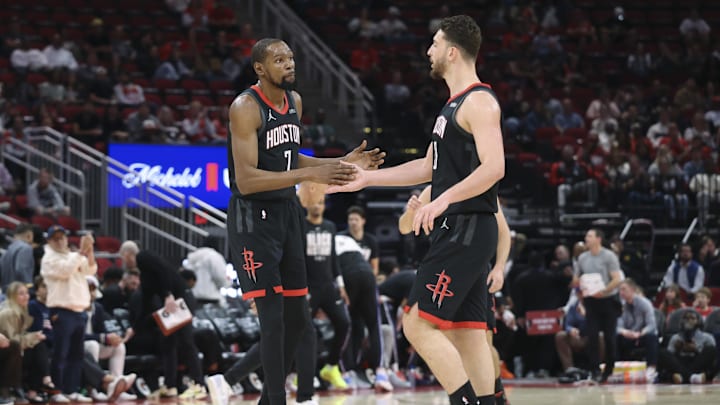 Feb 25, 2026; Houston, Texas, USA; Houston Rockets forward Kevin Durant (7) celebrates with center Alperen Sengun (28) after a play during the first quarter against the Sacramento Kings at Toyota Center. Mandatory Credit: Troy Taormina-Imagn Images