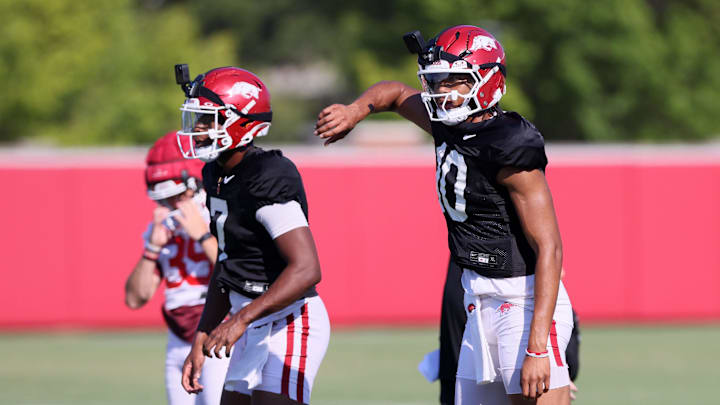Aug 14, 2025; Fayetteville, AR, USA; Arkansas Razorbacks quarterbacks KJ Jackson (7) and Taylen Green (10) during practice. Mandatory Credit: Nelson Chenault-Imagn Images