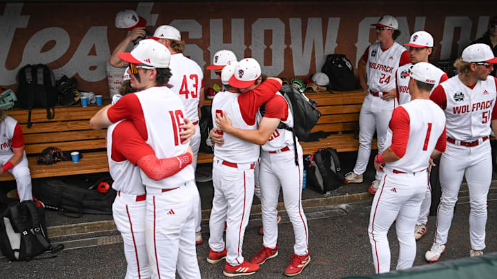 Jun 17, 2024; Omaha, NE, USA; NC State Wolfpack players greet each other after the loss against the Florida Gators at Charles Schwab Field Omaha. Mandatory Credit: Steven Branscombe-Imagn Images Jun 17, 2024; Omaha, NE, USA; NC State Wolfpack players greet each other after the loss against the Florida Gators at Charles Schwab Field Omaha. Mandatory Credit: Steven Branscombe-Imagn Images