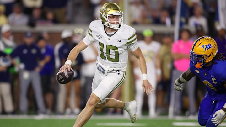 Nov 22, 2025; Atlanta, Georgia, USA; Georgia Tech Yellow Jackets quarterback Haynes King (10) scrambles against the Pittsburgh Panthers in the first quarter at Bobby Dodd Stadium at Hyundai Field. Mandatory Credit: Brett Davis-Imagn Images
