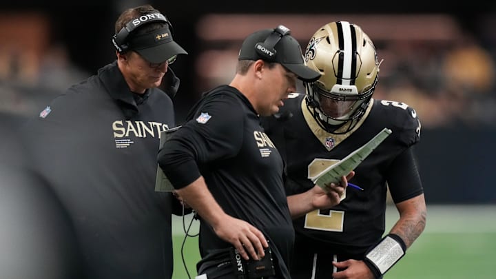 Oct 5, 2025; New Orleans, Louisiana, USA; New Orleans Saints head coach Kellen Moore talks to New Orleans Saints quarterback Spencer Rattler (2) against the New York Giants during the second quarter at Caesars Superdome. Mandatory Credit: Matthew Hinton-Imagn Images