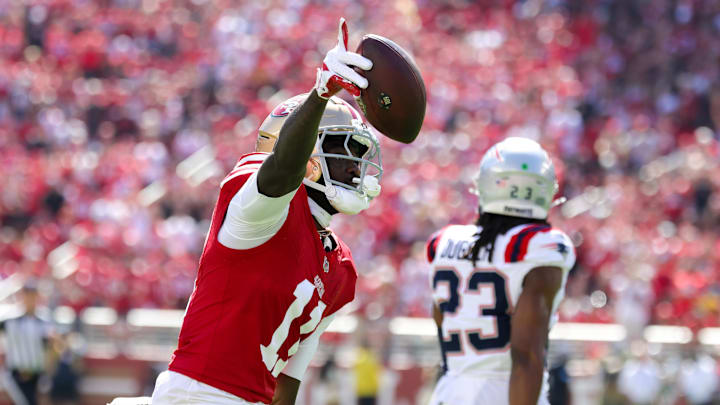 Sep 29, 2024; Santa Clara, California, USA; San Francisco 49ers wide receiver Brandon Aiyuk (11) celebrates after a catch against the New England Patriots during the first quarter at Levi's Stadium. Mandatory Credit: Sergio Estrada-Imagn Images