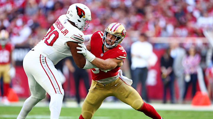 Dec 17, 2023; Glendale, Arizona, USA; San Francisco 49ers defensive end Nick Bosa (97) rushes against Arizona Cardinals offensive tackle Paris Johnson Jr. (70) during the first quarter at State Farm Stadium. Mandatory Credit: Mark J. Rebilas-USA TODAY Sports Dec 17, 2023; Glendale, Arizona, USA; San Francisco 49ers defensive end Nick Bosa (97) rushes against Arizona Cardinals offensive tackle Paris Johnson Jr. (70) during the first quarter at State Farm Stadium. Mandatory Credit: Mark J. Rebilas-USA TODAY Sports