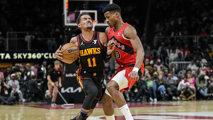 Feb 23, 2024; Atlanta, Georgia, USA; Atlanta Hawks guard Trae Young (11) is fouled by Toronto Feb 23, 2024; Atlanta, Georgia, USA; Atlanta Hawks guard Trae Young (11) is fouled by Toronto