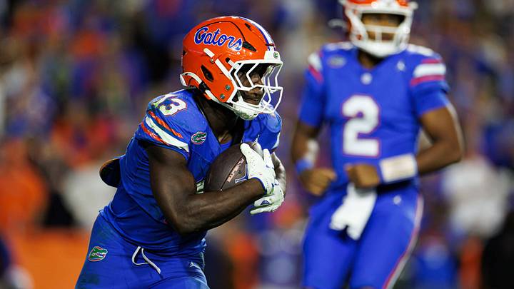Nov 29, 2025; Gainesville, Florida, USA; Florida Gators running back Jadan Baugh (13) rushes with the ball against the Florida State Seminoles during the second half at Ben Hill Griffin Stadium. Mandatory Credit: Matt Pendleton-Imagn Images Nov 29, 2025; Gainesville, Florida, USA; Florida Gators running back Jadan Baugh (13) rushes with the ball against the Florida State Seminoles during the second half at Ben Hill Griffin Stadium. Mandatory Credit: Matt Pendleton-Imagn Images
