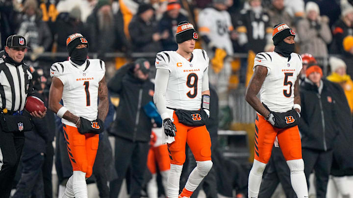 Cincinnati Bengals wide receiver Ja'Marr Chase (1), quarterback Joe Burrow (9) and wide receiver Tee Higgins (5) take the field as captains for the coin toss before the first quarter of the NFL Week 18 game between the Pittsburgh Steelers and the Cincinnati Bengals at Acrisure Stadium in Pittsburgh on Saturday, Jan. 4, 2025.