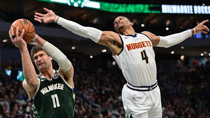 Feb 27, 2025; Milwaukee, Wisconsin, USA; Milwaukee Bucks center Brook Lopez (11) grabs a rebound against Denver Nuggets guard Russell Westbrook (4) in the second quarter at Fiserv Forum. Mandatory Credit: Benny Sieu-Imagn Images Feb 27, 2025; Milwaukee, Wisconsin, USA; Milwaukee Bucks center Brook Lopez (11) grabs a rebound against Denver Nuggets guard Russell Westbrook (4) in the second quarter at Fiserv Forum. Mandatory Credit: Benny Sieu-Imagn Images