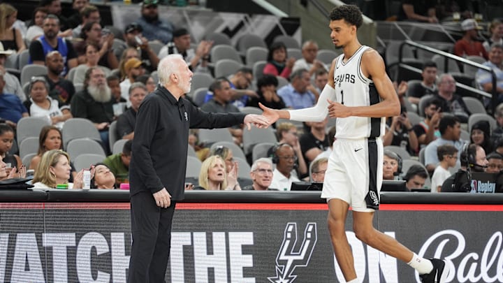Oct 9, 2024; San Antonio, Texas, USA; San Antonio Spurs head coach Gregg Popovich greets center Victor Wembanyama (1) in the first half against the Orlando Magic at Frost Bank Center. Mandatory Credit: Daniel Dunn-Imagn Images Oct 9, 2024; San Antonio, Texas, USA; San Antonio Spurs head coach Gregg Popovich greets center Victor Wembanyama (1) in the first half against the Orlando Magic at Frost Bank Center. Mandatory Credit: Daniel Dunn-Imagn Images