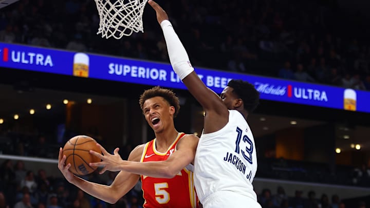 Mar 3, 2025; Memphis, Tennessee, USA; Atlanta Hawks guard Dyson Daniels (5) drives to the basket as Memphis Grizzlies forward Jaren Jackson Jr. (13) defends during the first quarter at FedExForum. Mandatory Credit: Petre Thomas-Imagn Images Mar 3, 2025; Memphis, Tennessee, USA; Atlanta Hawks guard Dyson Daniels (5) drives to the basket as Memphis Grizzlies forward Jaren Jackson Jr. (13) defends during the first quarter at FedExForum. Mandatory Credit: Petre Thomas-Imagn Images