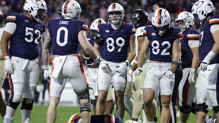Nov 8, 2025; Charlottesville, Virginia, USA; Virginia Cavaliers quarterback Chandler Morris (4) lays on the field after being injected against the Wake Forest Demon Deacons during the first half at Scott Stadium. Mandatory Credit: Amber Searls-Imagn Images